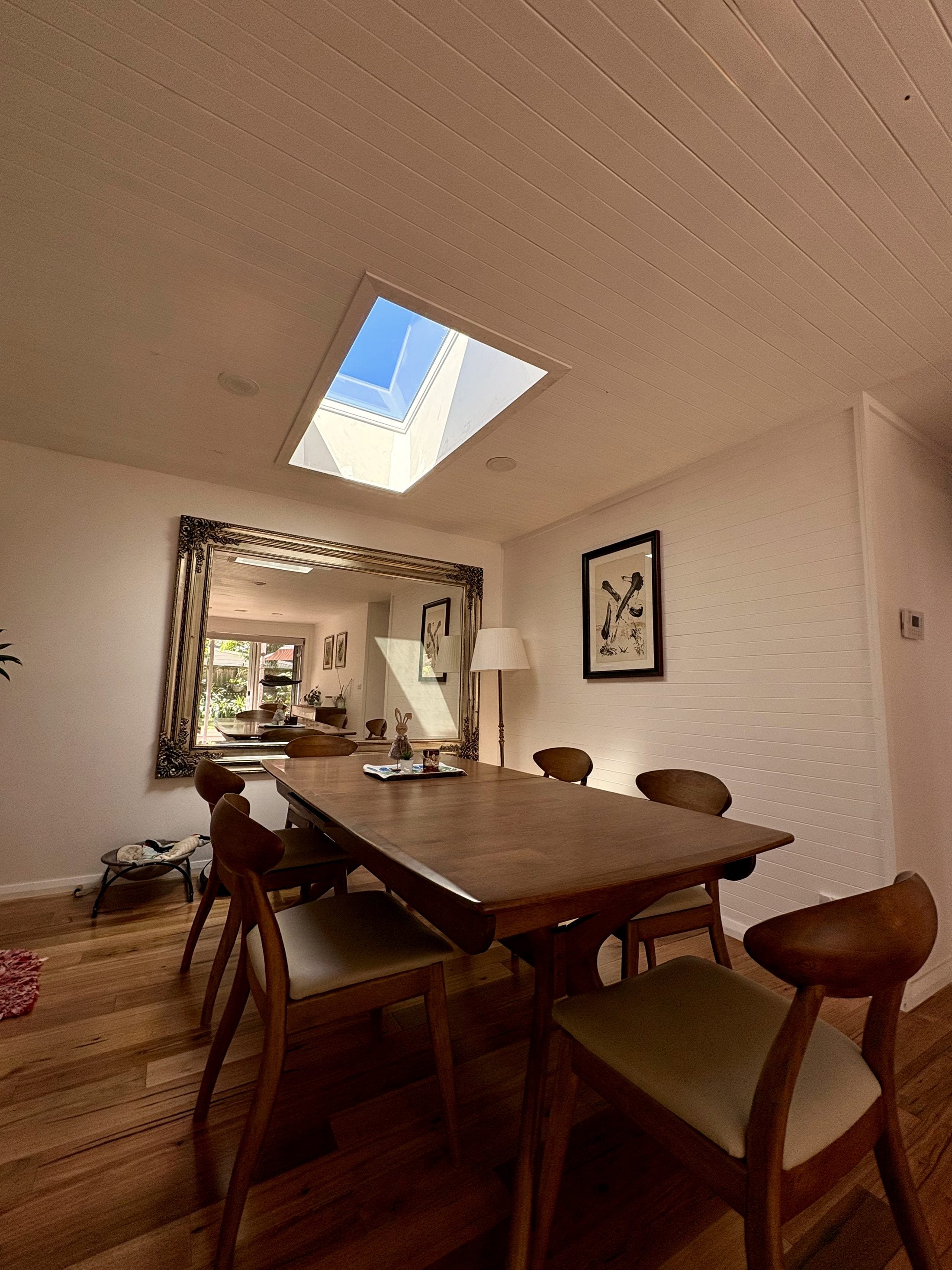 Pyramid skylight over a heritage dining room